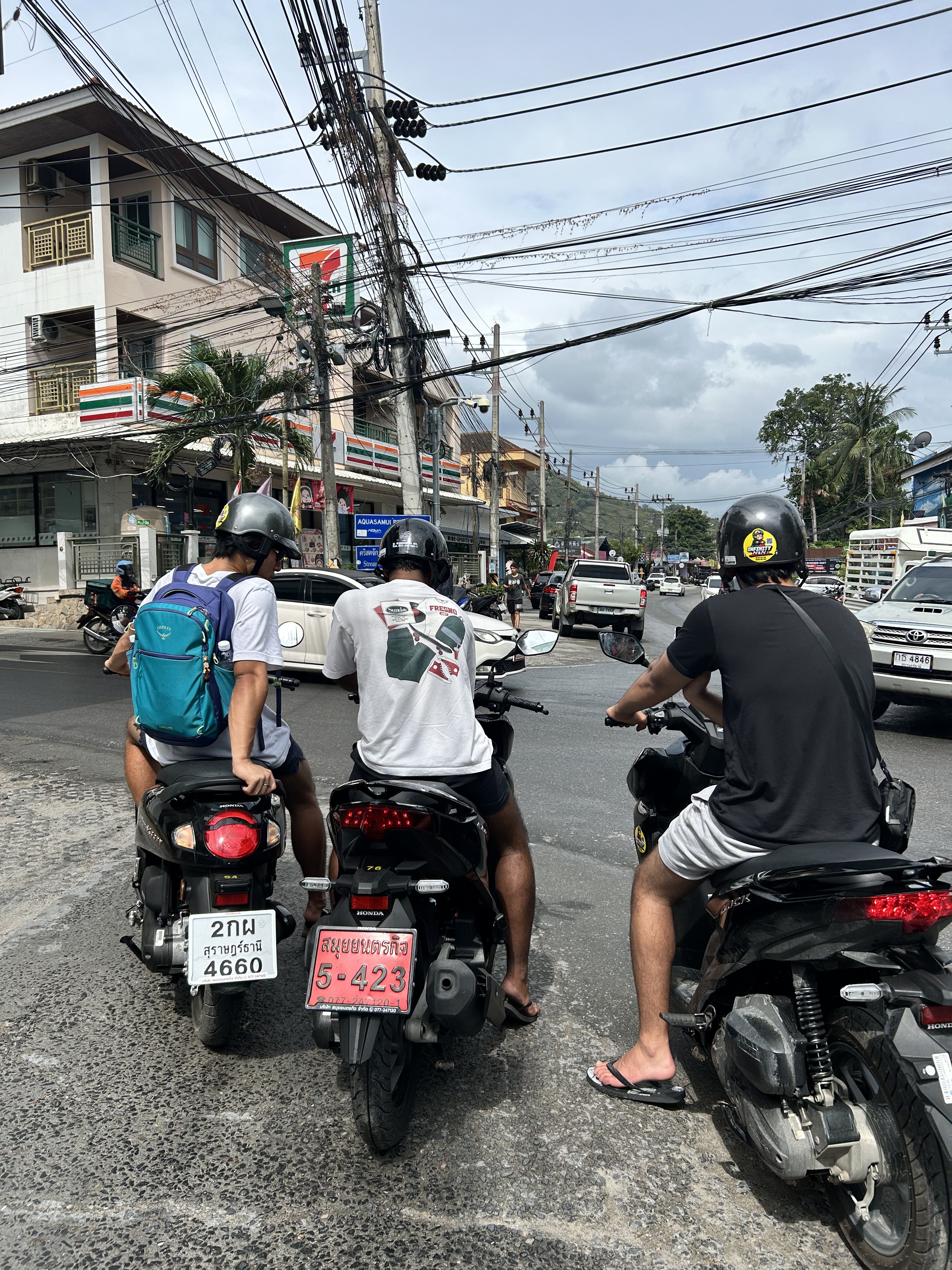 Friends scootering in Thailand